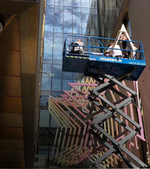 The team installing a new piece of art for our client.